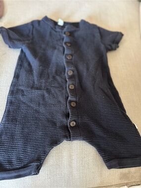Nui black Ribbed Button-Front Baby One-Piece